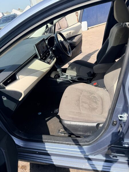 Car interior seat before valeting, with visible staining