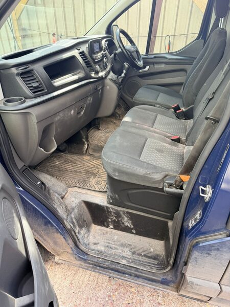 Van interior before valeting, dusty seats and floor